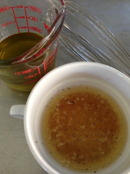 Add the olive oil slowly to emulsify it this honey cider dressing.