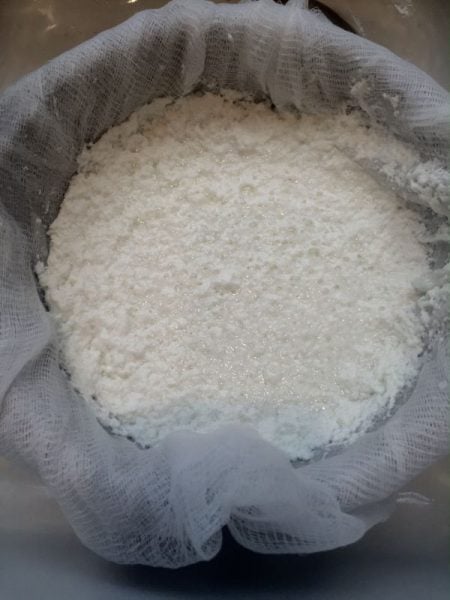 Straining ricotta