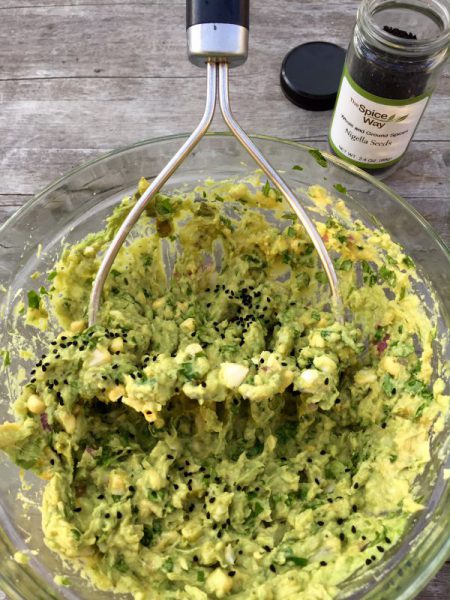 Making guacamole with corn.